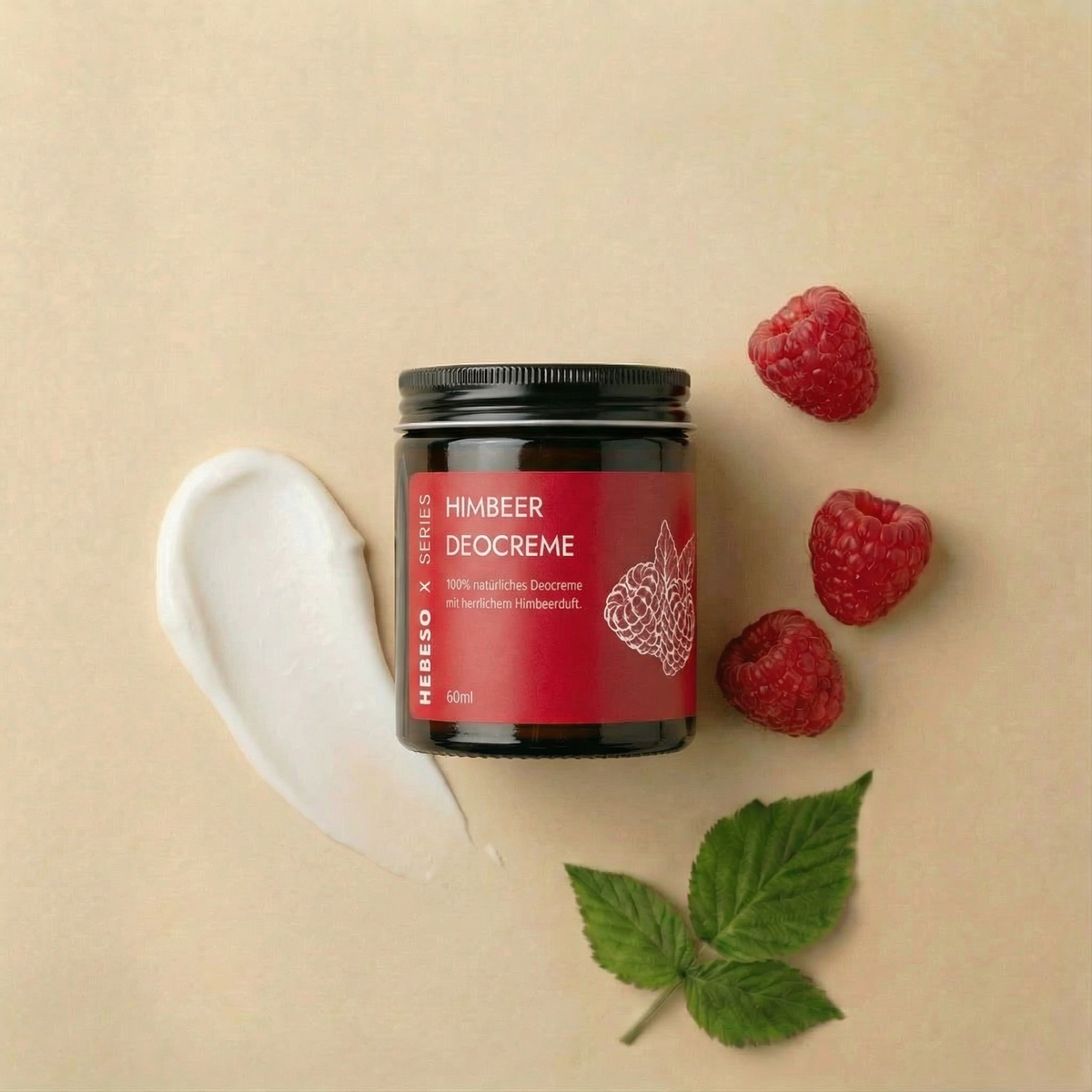 HEBESO Himbeer Deocreme 60 ml mit Cremeprobe, Himbeeren und Blättern.