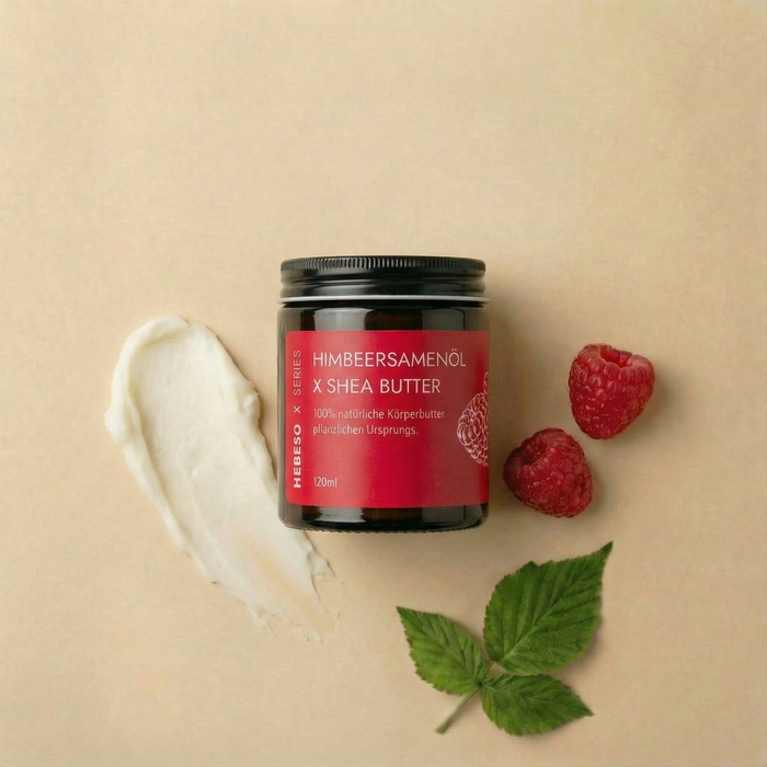 HEBESO Himbeersamenöl Körperbutter 120 ml mit Cremeprobe, Himbeeren und Blättern.